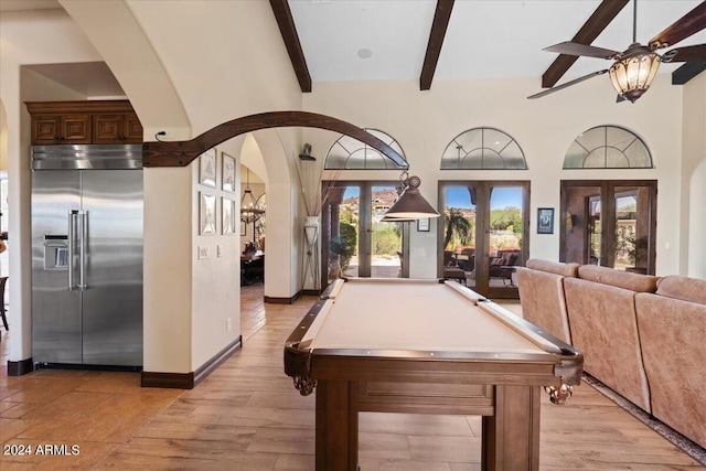 game room with pool table, french doors, light hardwood / wood-style floors, ceiling fan, and beam ceiling