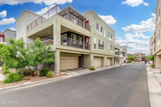 1250 N Abbey Ln Unit 206, Chandler, AZ 85226 - view of property featuring an attached garage and a residential view