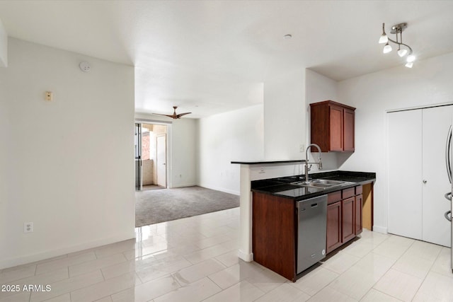 kitchen with open floor plan, baseboards, a sink, ceiling fan, and dishwasher