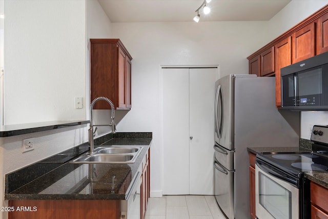 kitchen featuring a sink, black microwave, stainless steel range with electric stovetop, dishwashing machine, and dark stone countertops