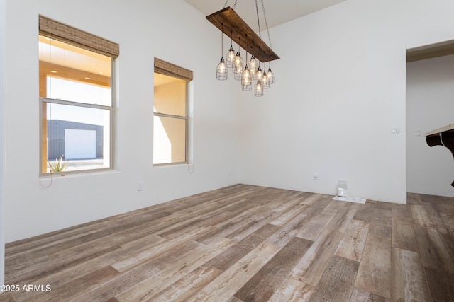 unfurnished dining area with hardwood / wood-style floors