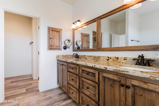 bathroom featuring vanity and hardwood / wood-style flooring