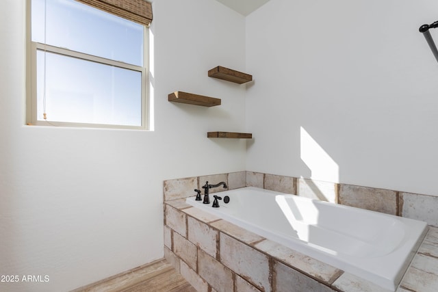 bathroom with tiled tub