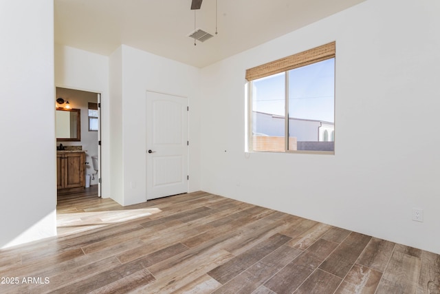 unfurnished room with ceiling fan