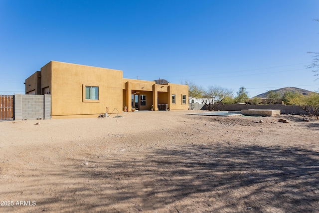 rear view of house with a mountain view