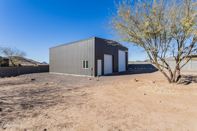 view of outdoor structure featuring a garage