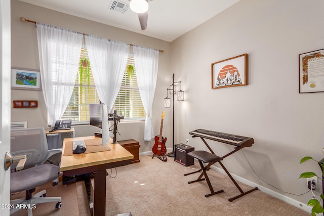 carpeted home office with ceiling fan