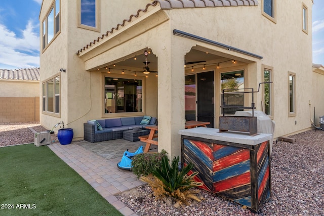 view of patio featuring ceiling fan