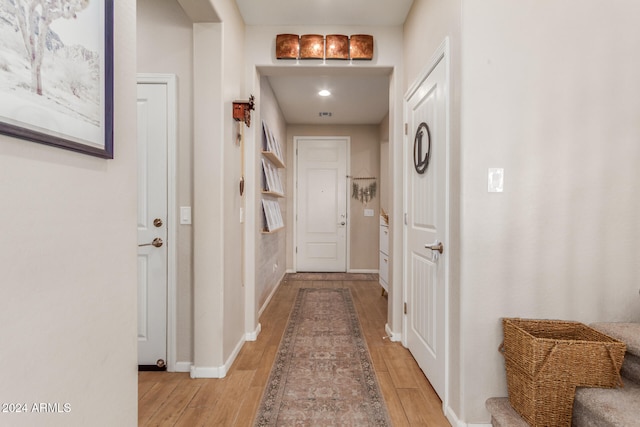 doorway to outside featuring light hardwood / wood-style flooring