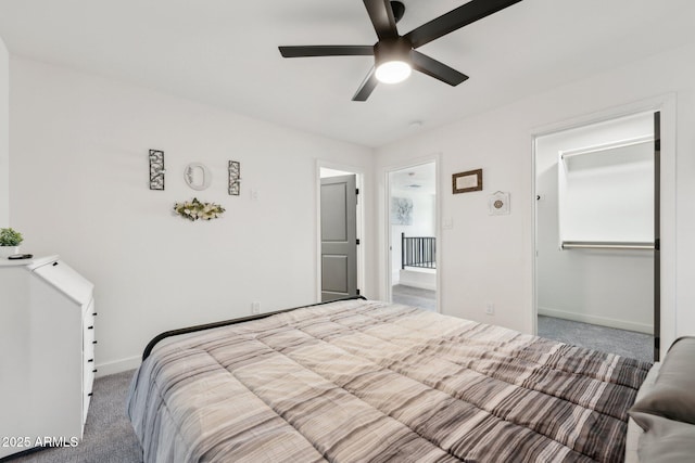 carpeted bedroom with baseboards and ceiling fan