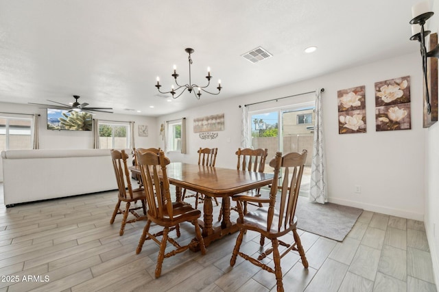 dining area featuring recessed lighting, a chandelier, a ceiling fan, light wood-type flooring, and baseboards