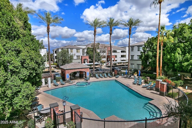 pool featuring a residential view, a patio, a gazebo, and fence