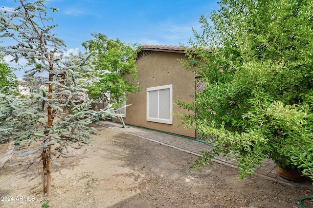 view of property exterior featuring a patio