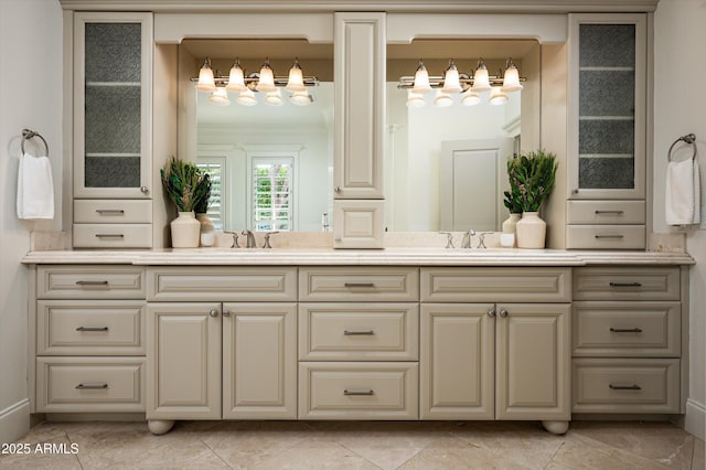 full bathroom featuring double vanity, a sink, and crown molding