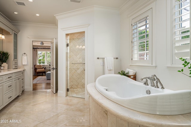 ensuite bathroom with crown molding, a tub to relax in, vanity, a shower stall, and visible vents