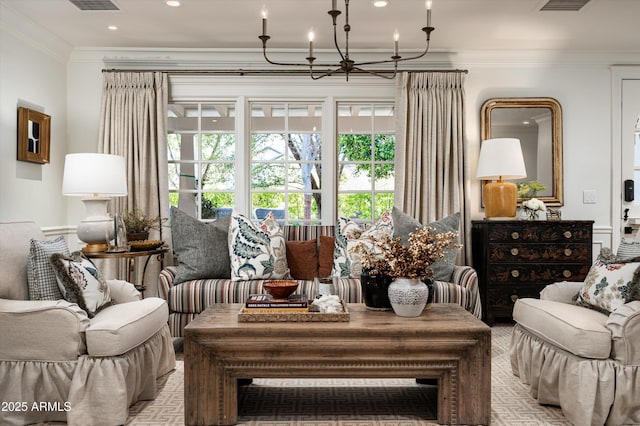 living room with a notable chandelier, visible vents, recessed lighting, and crown molding