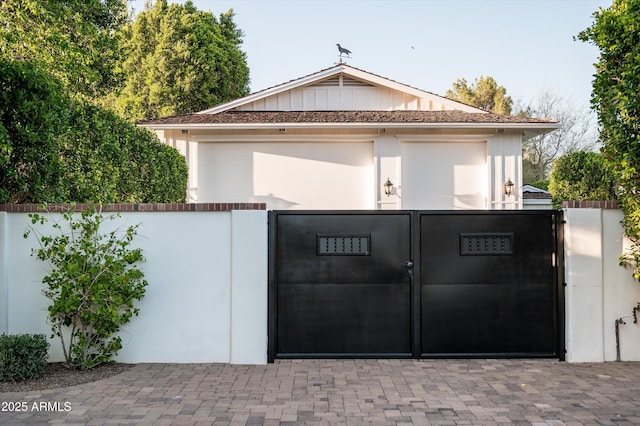 view of gate featuring fence