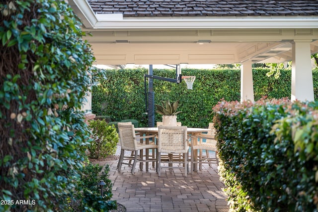 view of patio featuring outdoor dining space and a gazebo