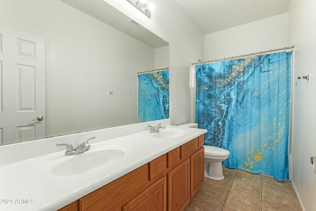 bathroom featuring vanity, tile patterned flooring, toilet, and curtained shower