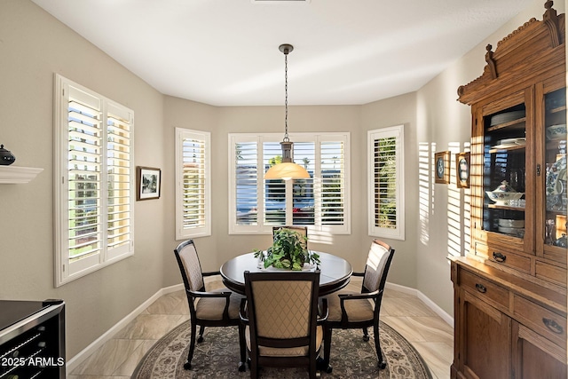 dining room with baseboards