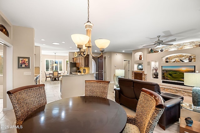 dining space with built in shelves, a ceiling fan, and recessed lighting