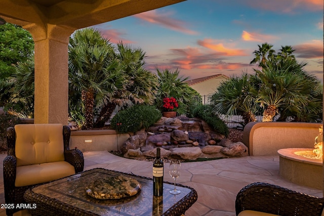 view of patio / terrace with an outdoor fire pit