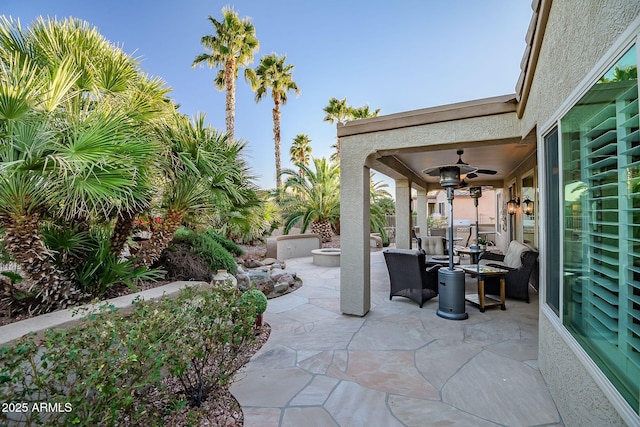 view of patio with ceiling fan