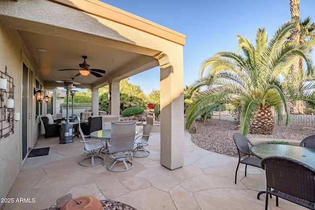 view of patio with ceiling fan and outdoor dining space