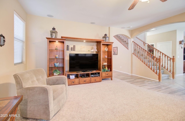 708 E Dry Creek Rd, San Tan Valley, AZ 85143 - living area featuring stairs, a ceiling fan, carpet, and arched walkways