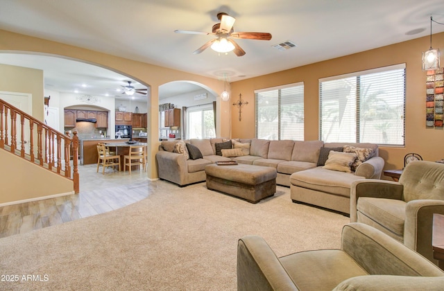 708 E Dry Creek Rd, San Tan Valley, AZ 85143 - living area with a ceiling fan, arched walkways, and light colored carpet