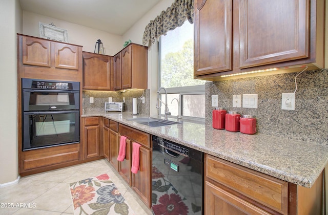 708 E Dry Creek Rd, San Tan Valley, AZ 85143 - kitchen featuring black appliances, light stone countertops, backsplash, light tile patterned flooring, and brown cabinets