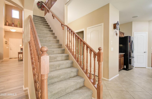 708 E Dry Creek Rd, San Tan Valley, AZ 85143 - stairway with baseboards and tile patterned floors