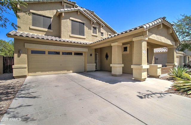 708 E Dry Creek Rd, San Tan Valley, AZ 85143 - mediterranean / spanish house featuring stucco siding, driveway, a tile roof, and a garage