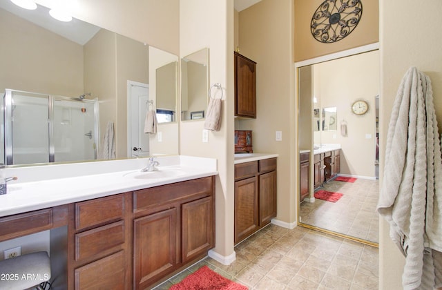 708 E Dry Creek Rd, San Tan Valley, AZ 85143 - bathroom with vanity, a stall shower, a towering ceiling, and tile patterned flooring