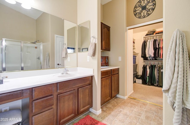 708 E Dry Creek Rd, San Tan Valley, AZ 85143 - full bathroom featuring a stall shower, vanity, and a spacious closet
