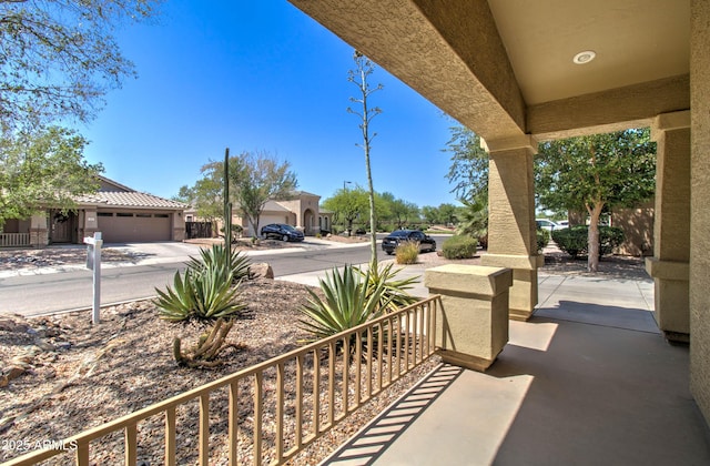 708 E Dry Creek Rd, San Tan Valley, AZ 85143 - view of patio with an attached garage and driveway