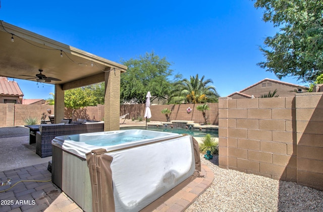 708 E Dry Creek Rd, San Tan Valley, AZ 85143 - fenced backyard with a hot tub, a ceiling fan, and a patio area