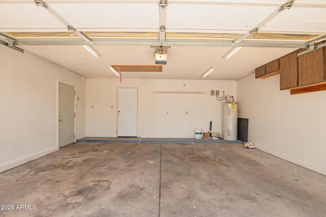 garage with water heater, a garage door opener, and baseboards