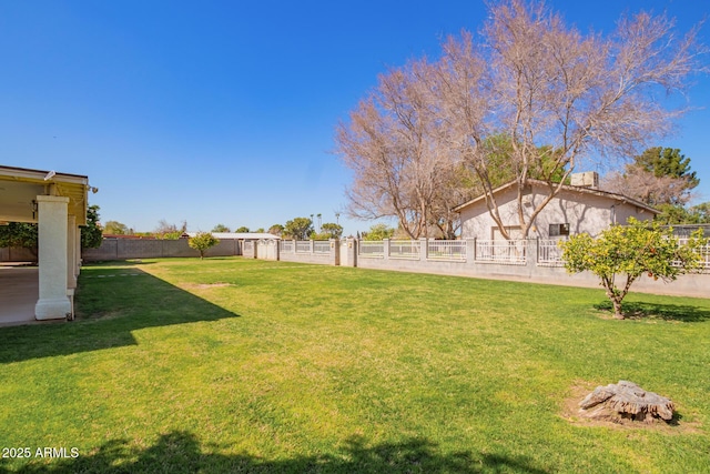 view of yard with a fenced backyard