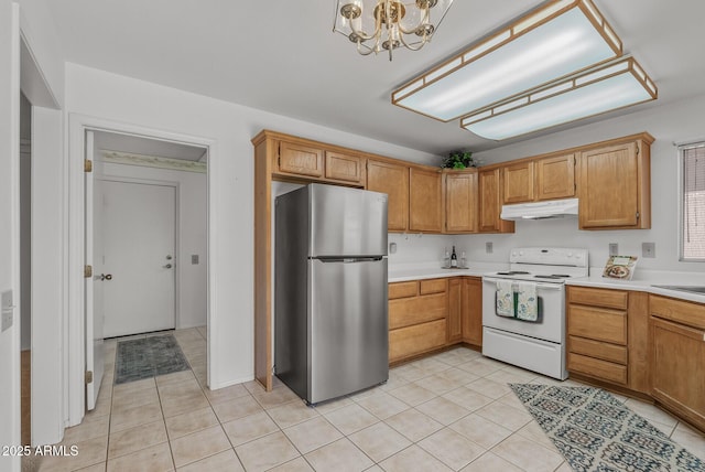 kitchen with white electric range oven, freestanding refrigerator, light tile patterned floors, and under cabinet range hood