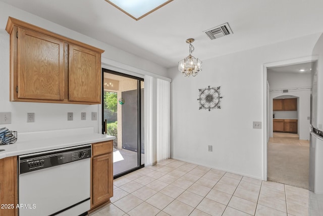 kitchen featuring pendant lighting, visible vents, dishwasher, light countertops, and a notable chandelier