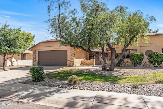 mid-century inspired home featuring a garage, stucco siding, and concrete driveway
