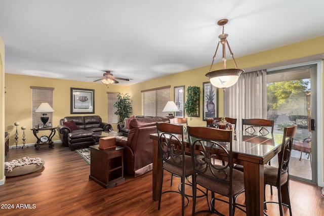 dining space featuring ceiling fan and dark wood-type flooring