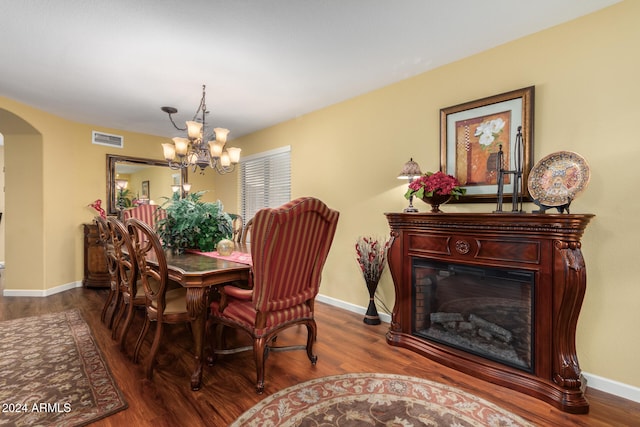 dining area featuring a chandelier and hardwood / wood-style flooring