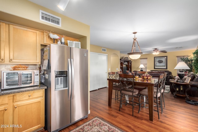 kitchen featuring ceiling fan, dark hardwood / wood-style flooring, stainless steel refrigerator with ice dispenser, and light brown cabinetry