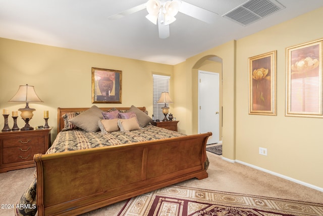 bedroom featuring light carpet and ceiling fan