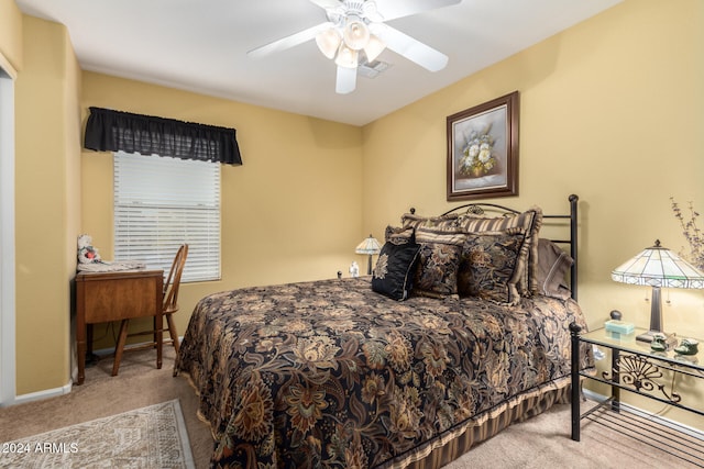 bedroom with light colored carpet and ceiling fan