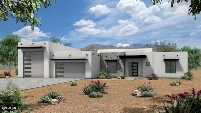 view of front of house featuring a mountain view and a garage