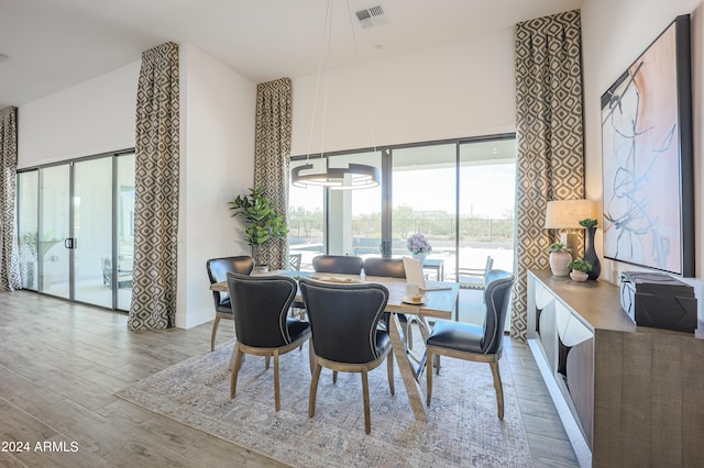 dining area with light hardwood / wood-style floors