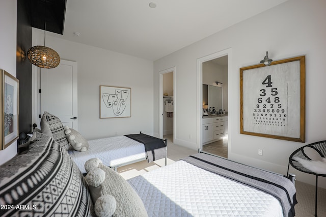 carpeted bedroom featuring ensuite bath